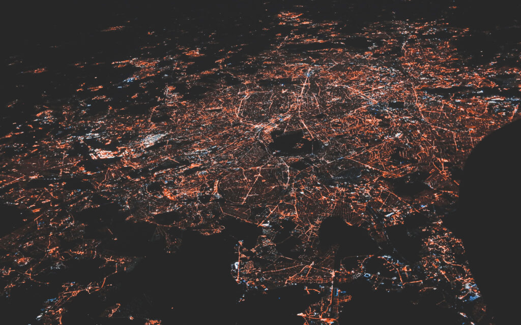 Vibrant Aerial City Network at Night - Stunning Wallpaper Background