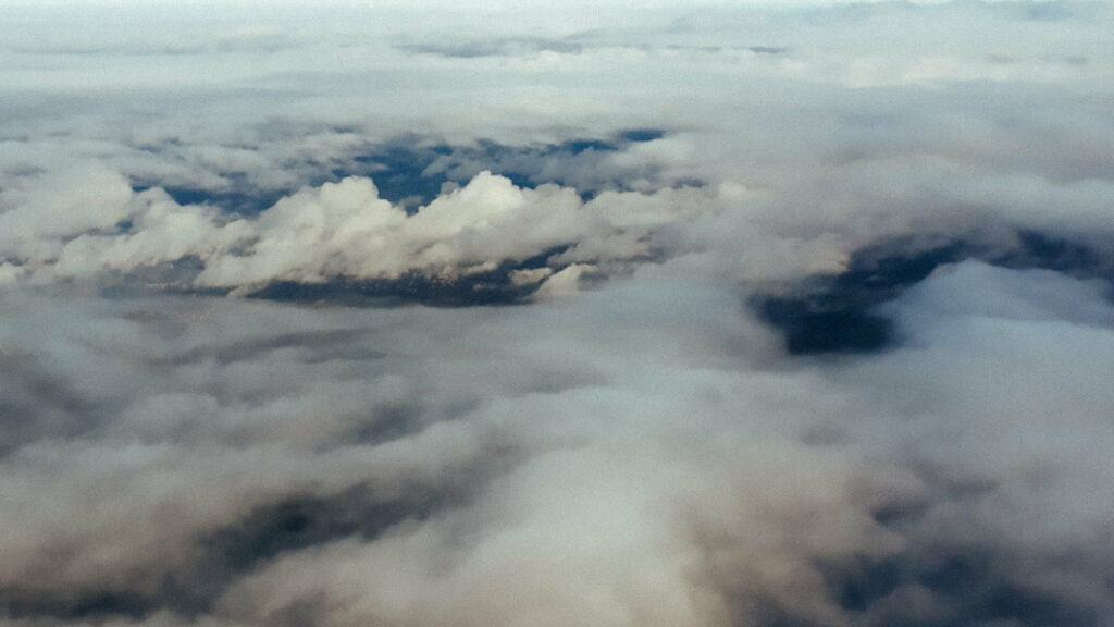 Stunning Aerial HD Wallpaper: Billowing Clouds & Serene Blue Sky