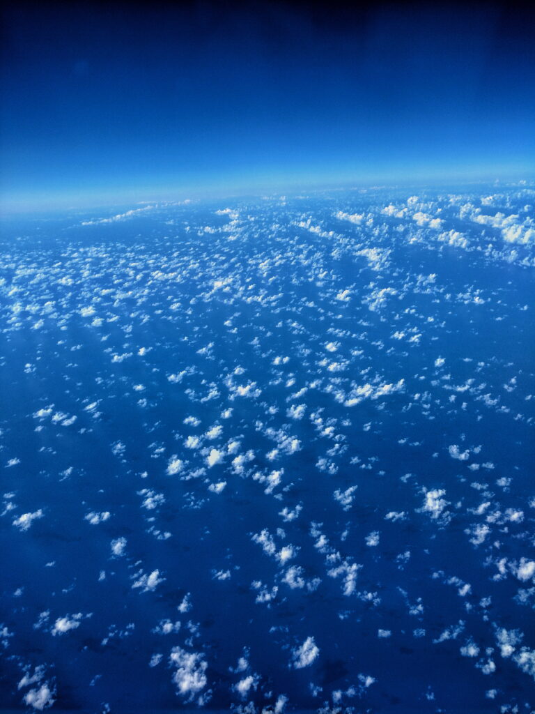 Aerial View HD Wallpaper: Stunning Clouds & Deep Blue Atmosphere