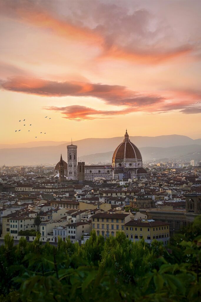 Historic Cityscape Aerial View: Iconic Cathedral at Sunset Wallpaper
