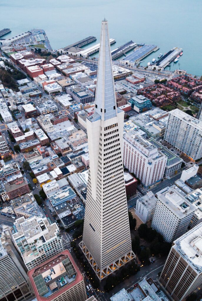 Stunning Skyscraper Aerial Wallpaper: Cityscape & Serene Pier View