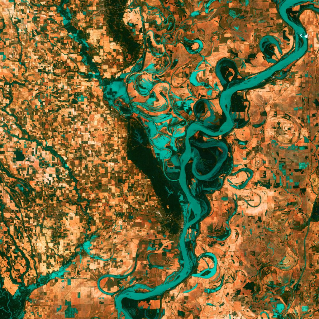 Stunning Aerial View: Winding River in Diverse Landscape Background Wallpaper
