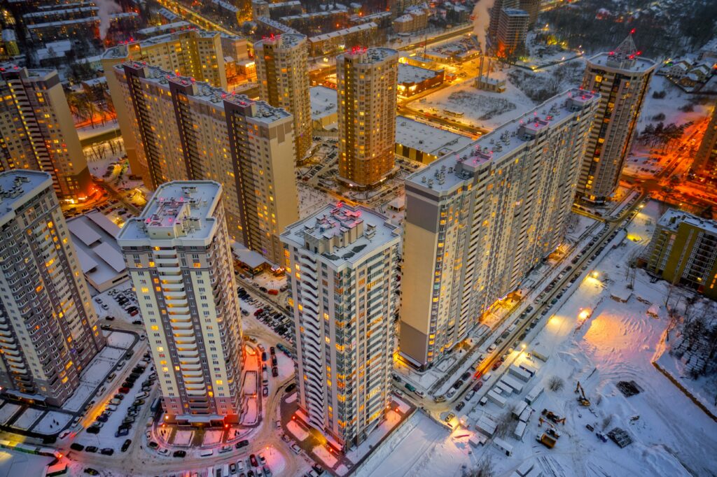 Aerial Winter Cityscape Wallpaper: Twilight Serenity & Warm Glow