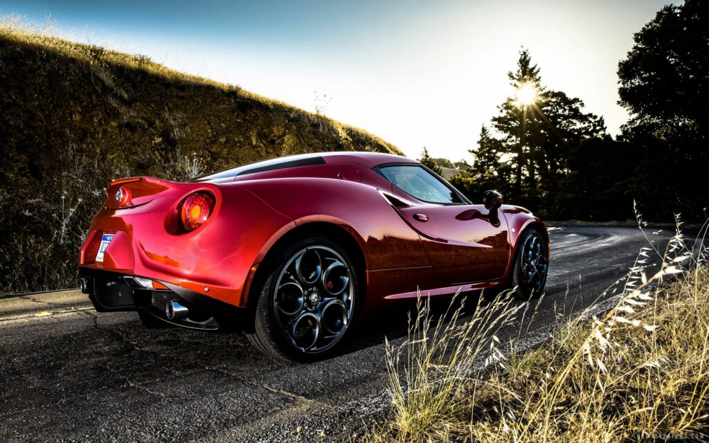 Stunning Red Alfa Romeo 4C Wallpaper with Scenic Background
