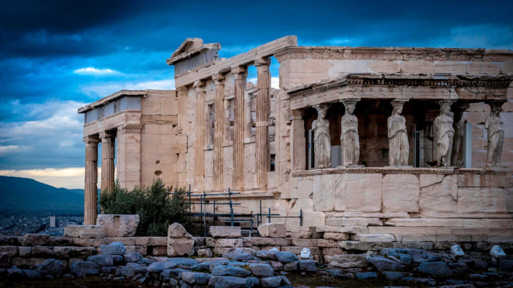 Ancient Greek Marvel Wallpaper: Ruins & Dramatic Sky Background