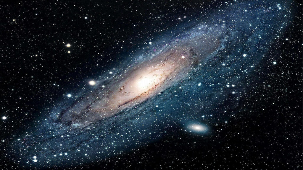 Stunning Andromeda Galaxy wallpaper in HD, showcasing vibrant stars in a vast space background.