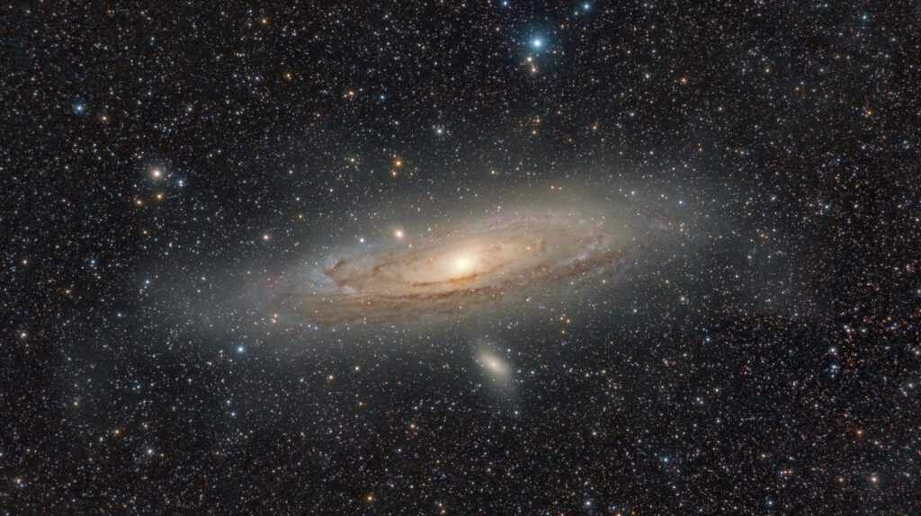 Andromeda Galaxy Wallpaper: Majestic Design with Glowing Stars