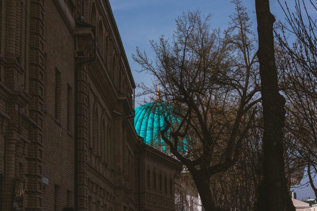 Stunning Turquoise Dome Wallpaper Over Elegant Brick Building
