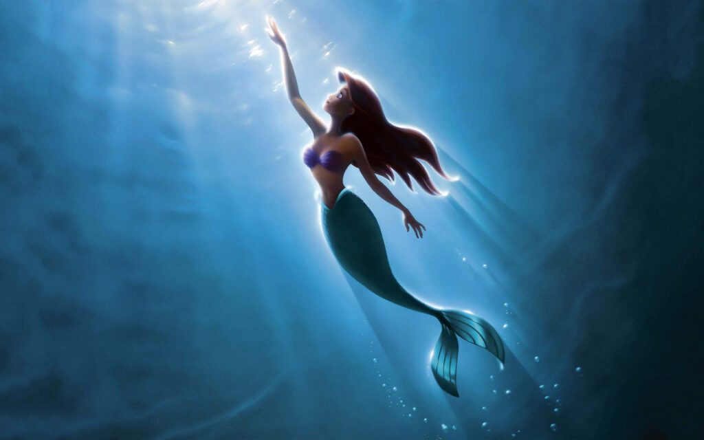 Radiant Ariel Wallpaper: The Little Mermaid Reaching for the Surface