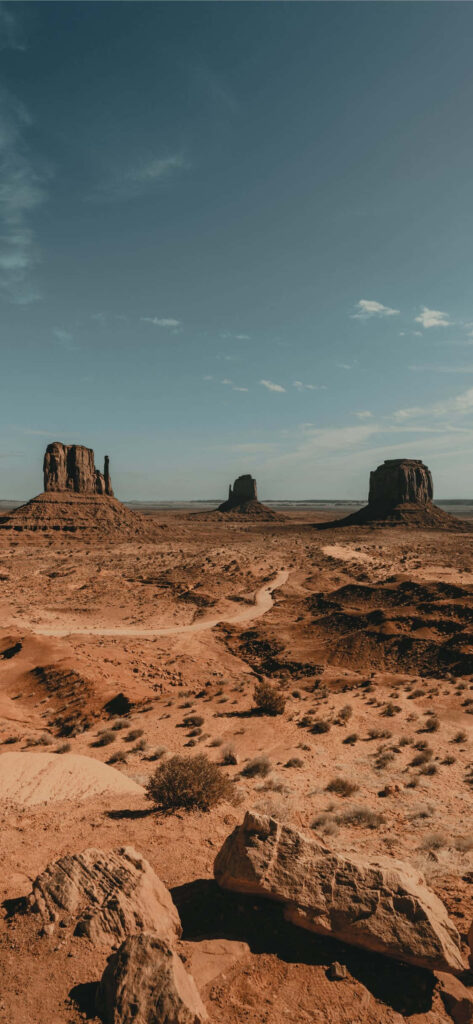 Arizona Desert Wallpaper: Rugged Rock Formations & Clear Sky Background