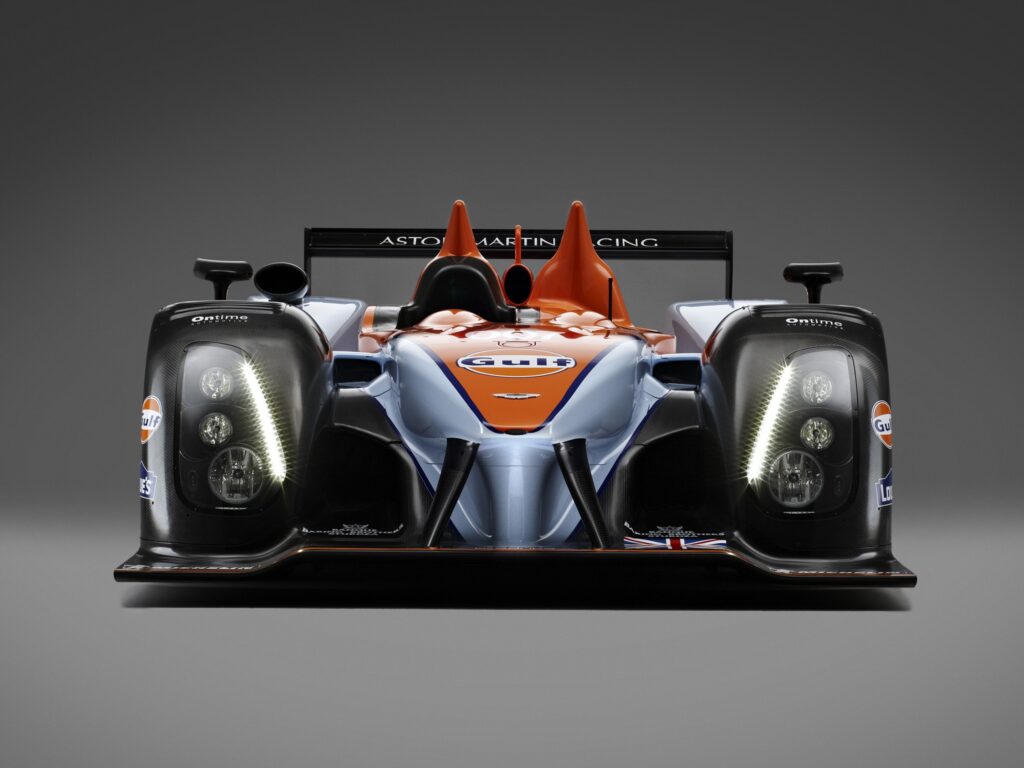 Striking Aston Martin AMR-One LMP1 Wallpaper: Black & Orange Design