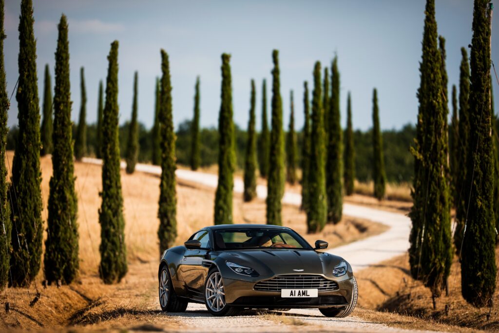 Elegant Aston Martin DB1 Wallpaper in Scenic Landscape Background