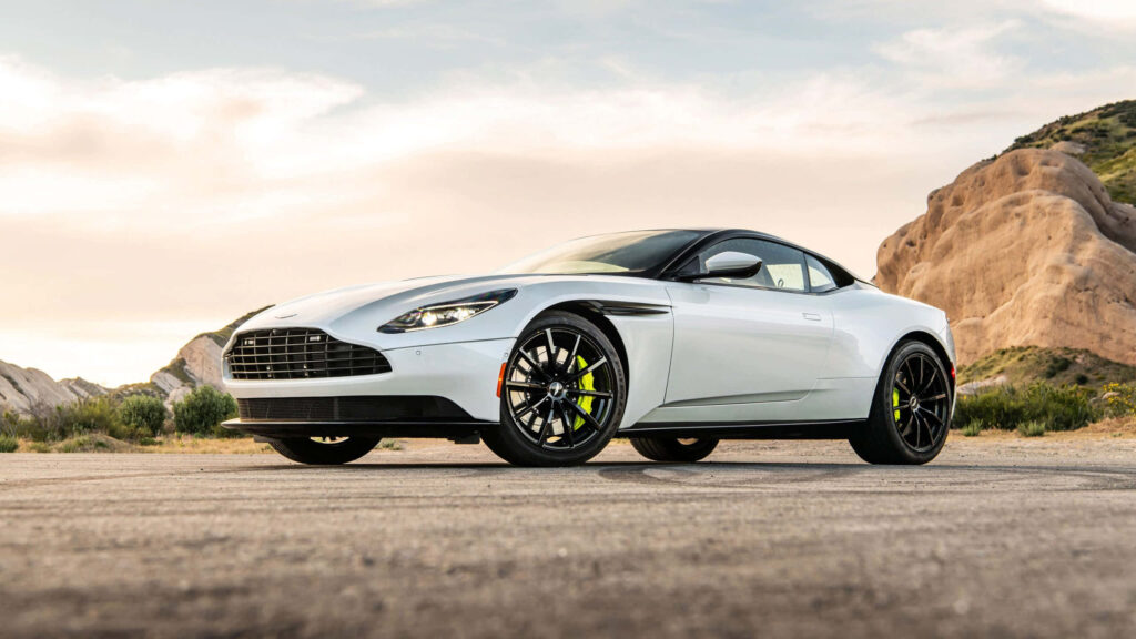 Sleek Aston Martin DB11 Wallpaper: Scenic Road & Stunning Backdrop