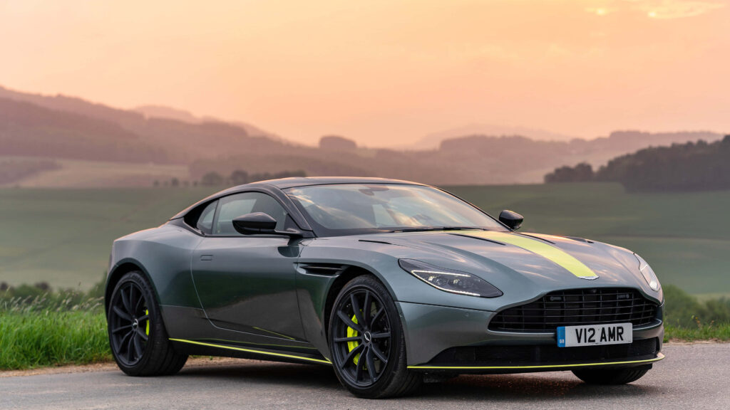 Aston Martin DB11 Wallpaper: Luxury Design & Scenic Sunset Background