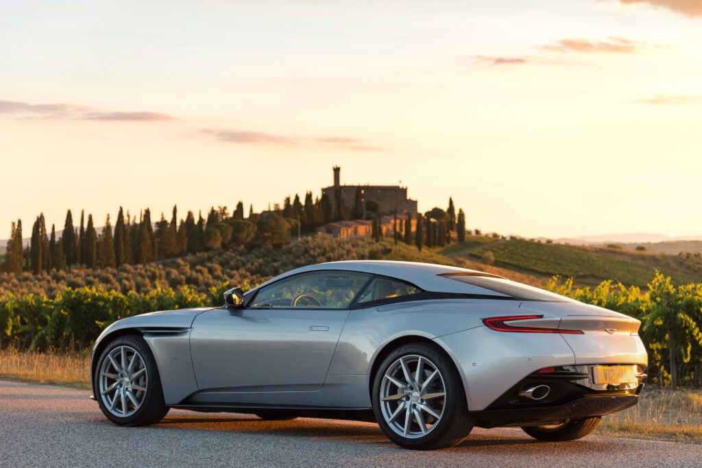 Aston Martin DB11 Side View Wallpaper in Picturesque Countryside