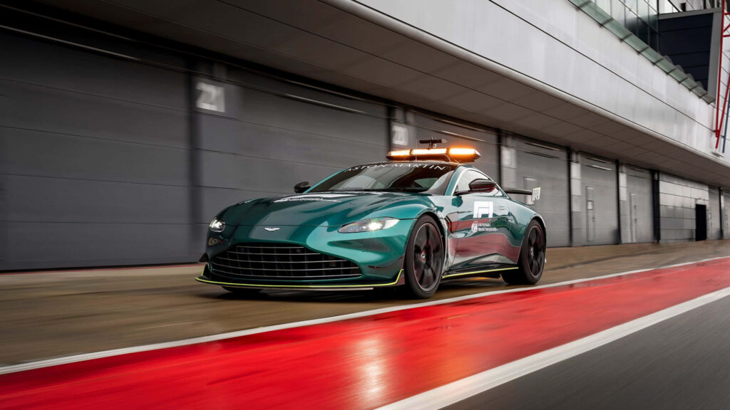 Elegant Aston Martin Racetrack Wallpaper: Power & Performance Showcase