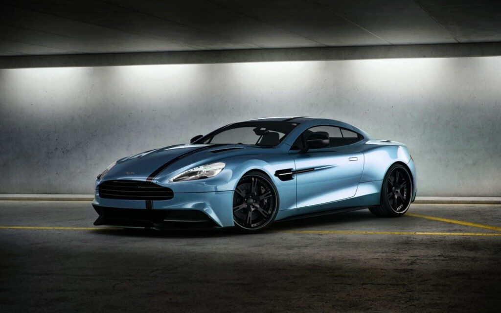 Luxury Aston Martin Vanquish Wallpaper in Modern Garage Setting