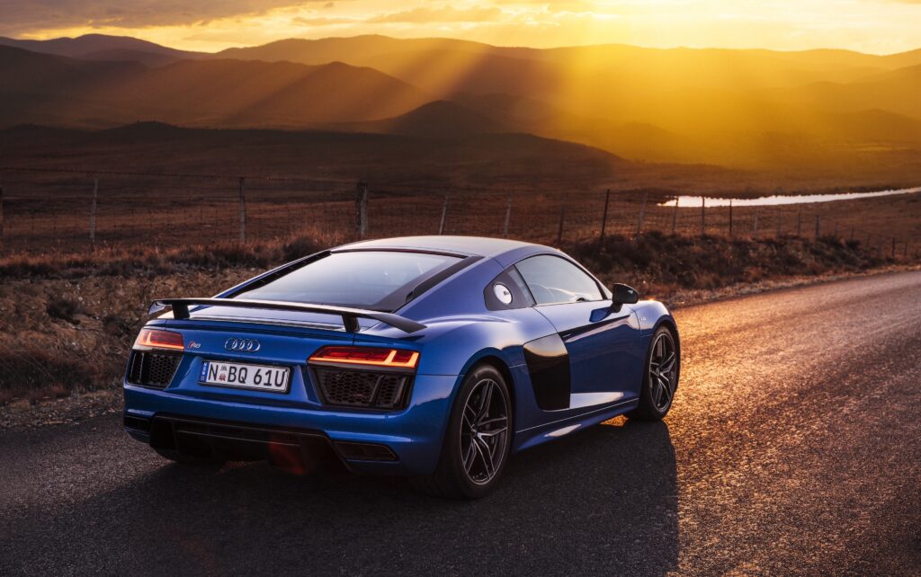 Stunning Blue Audi R8 V10 Wallpaper: Elegance Meets Scenic Sunset