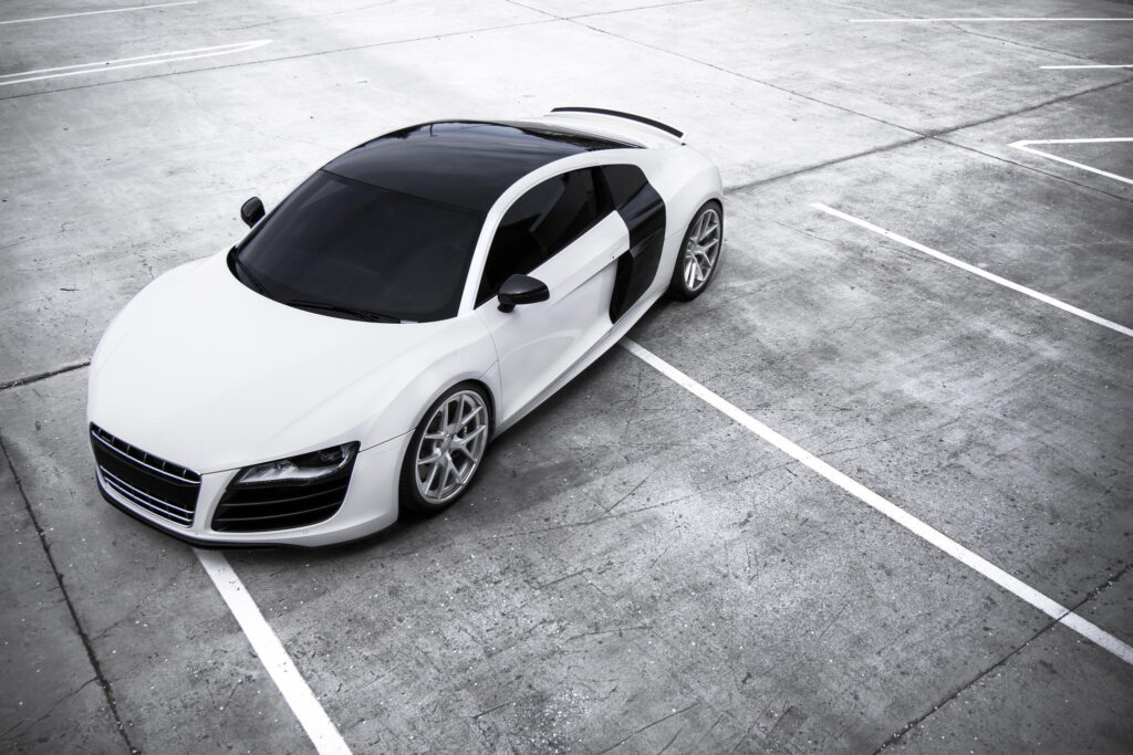 Sleek White Audi R8 Top View in Empty Parking Lot Wallpaper