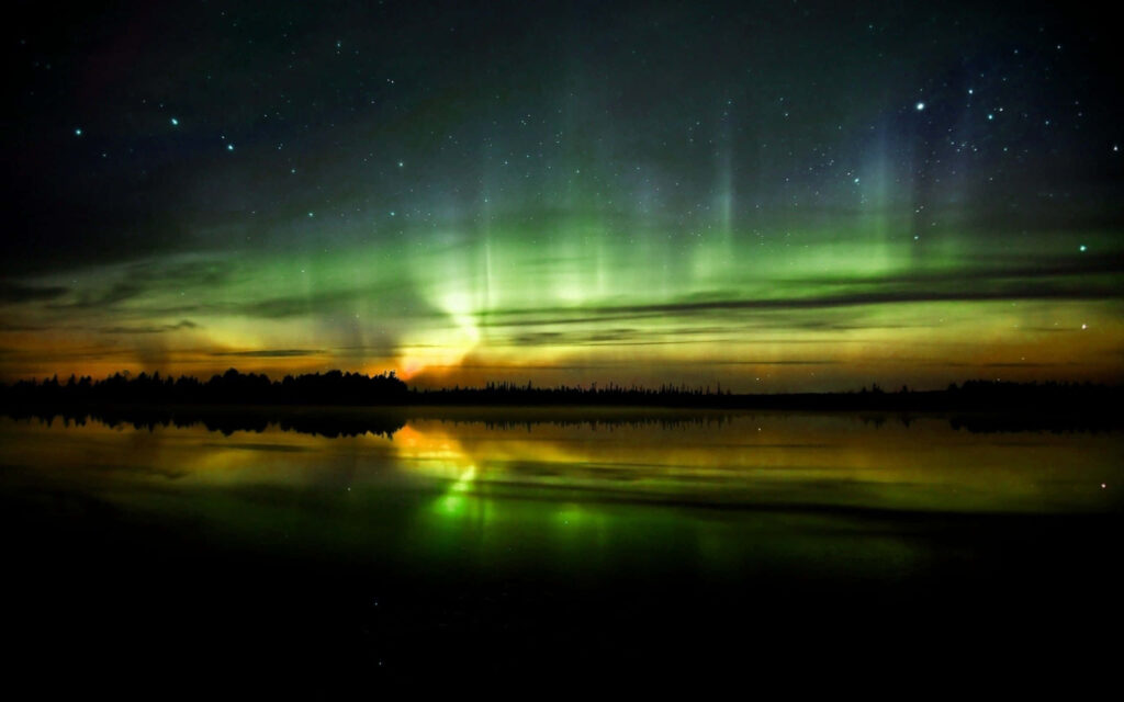 Aurora Display Wallpaper: Serene Beauty Over Calm Lake at Night