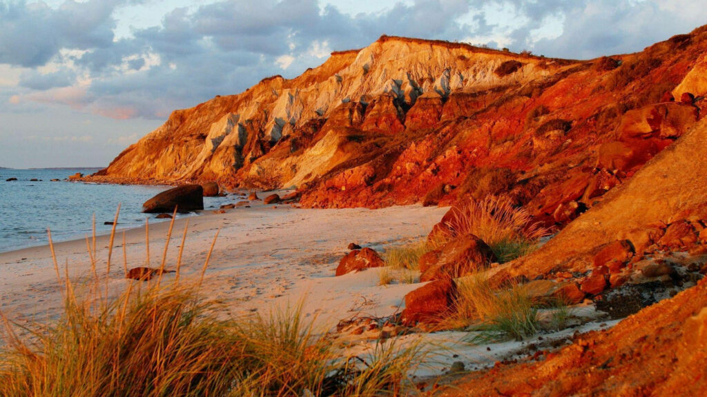 Golden Autumn Beach: Serene Coastal Cliffs & Sandy Shores Wallpaper