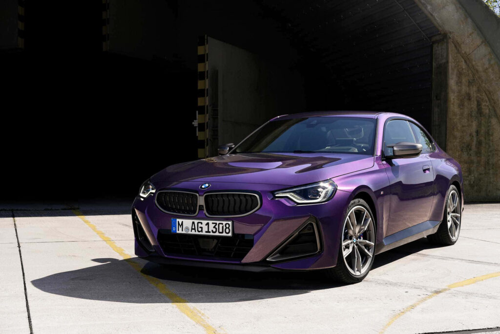 Stunning BMW 2 Series Coupe Wallpaper: Bold Purple in Modern Setting