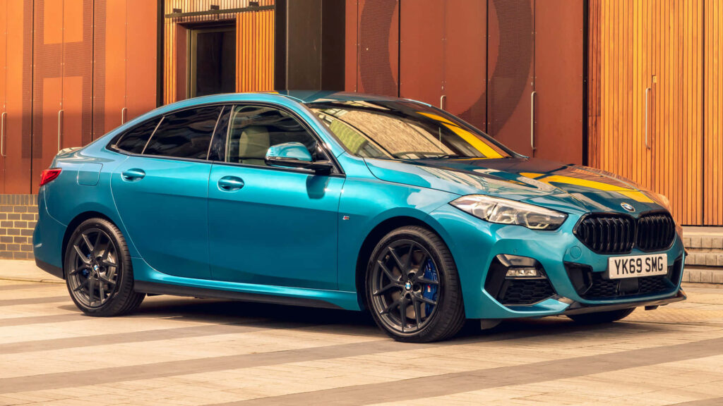 Stunning BMW 2 Series Wallpaper: Aerodynamic Design in Urban Setting