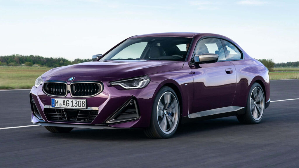 Dynamic BMW 2 Series Wallpaper: Sleek Purple Elegance in Motion