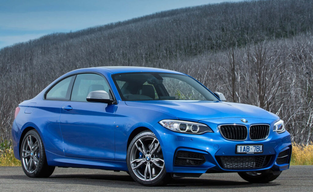 Stylish BMW 2 Series Wallpaper in Serene Natural Setting