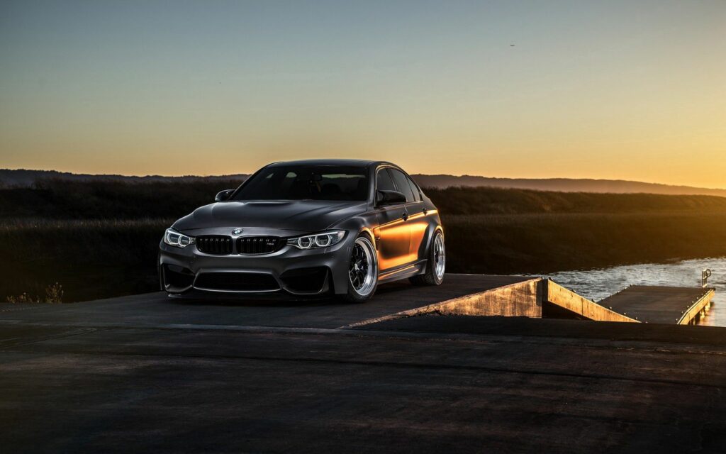 Stunning BMW F80 M3 at Sunset: Sleek Design Wallpaper