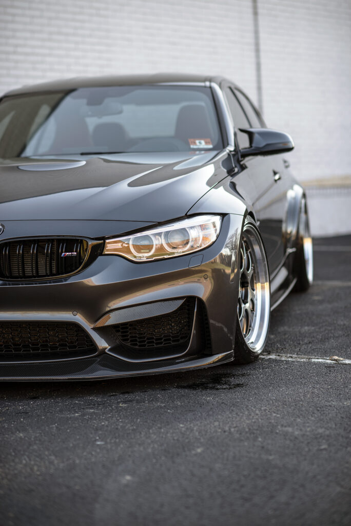 Stunning BMW M3 Front View: Sleek Design & Striking Headlights Wallpaper