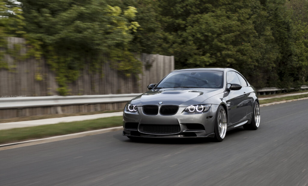 BMW M3 Front View Wallpaper: Sleek Sporty Design on Asphalt Road