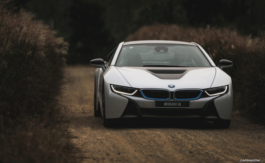 Stunning White BMW i8 on Rustic Path - Futuristic Design Showcase Wallpaper