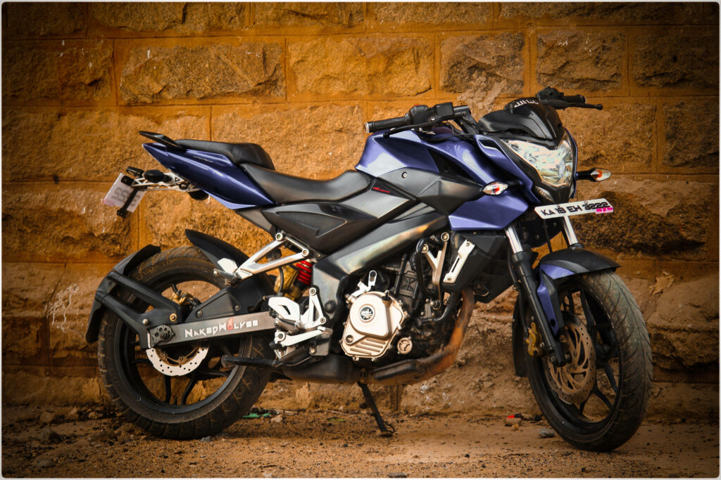 Bajaj Pulsar NS 200 Motorcycle Wallpaper with Rugged Rock Backdrop