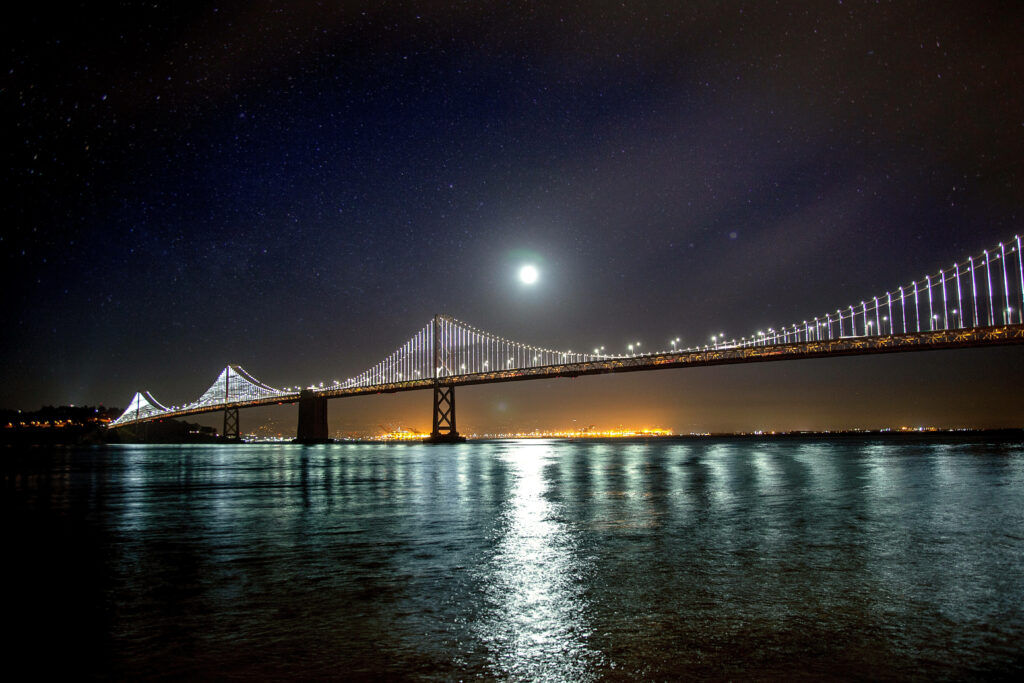 Stunning Bay Bridge Night Sky Wallpaper: Illuminated & Serene