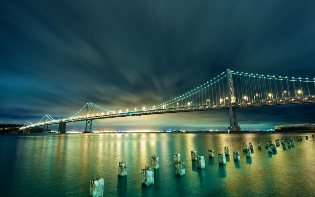 Stunning Bay Bridge Night View: Illuminated Reflection Wallpaper