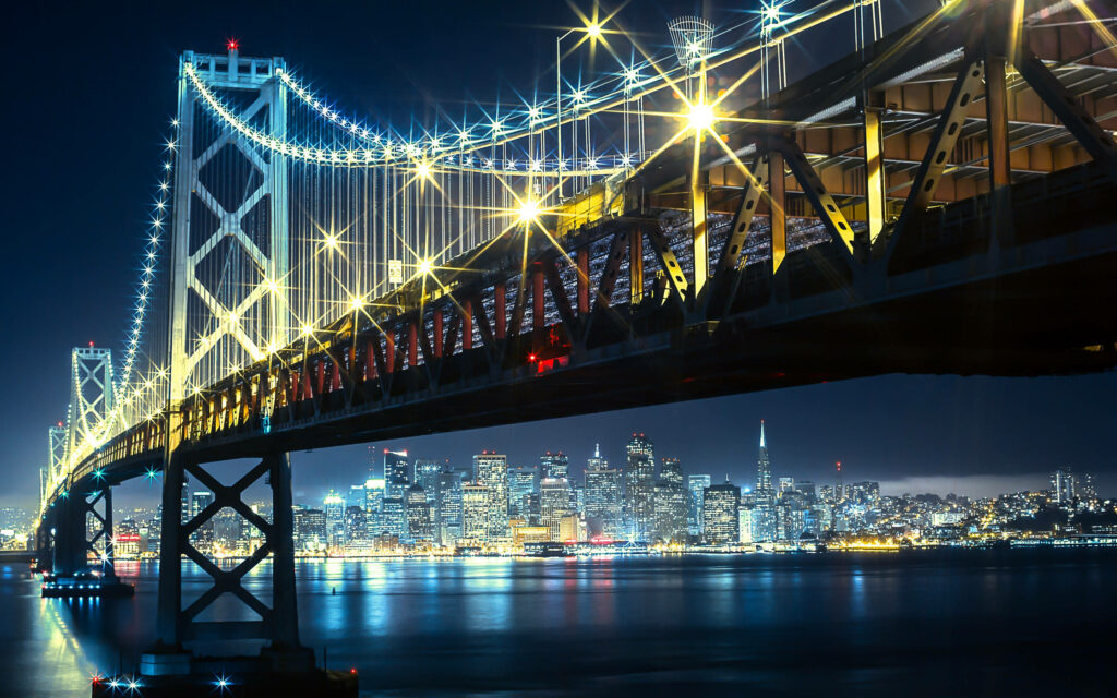 Stunning Bay Bridge Night View Wallpaper: City Skyline Reflections