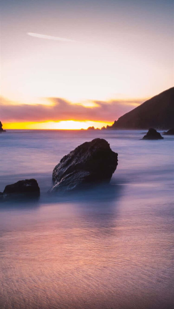 Serene Beach Sunset Wallpaper: Orange & Purple Coastal Beauty