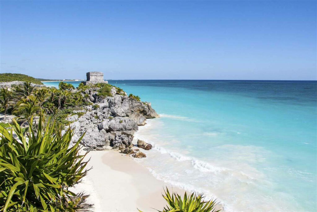 Scenic Beach Wallpaper: Clear Waters & Historic Coastal Charm