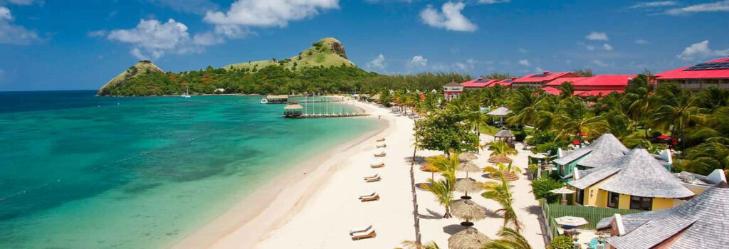 Beachfront Paradise: Sandals Grande St. Lucia Wallpaper Background