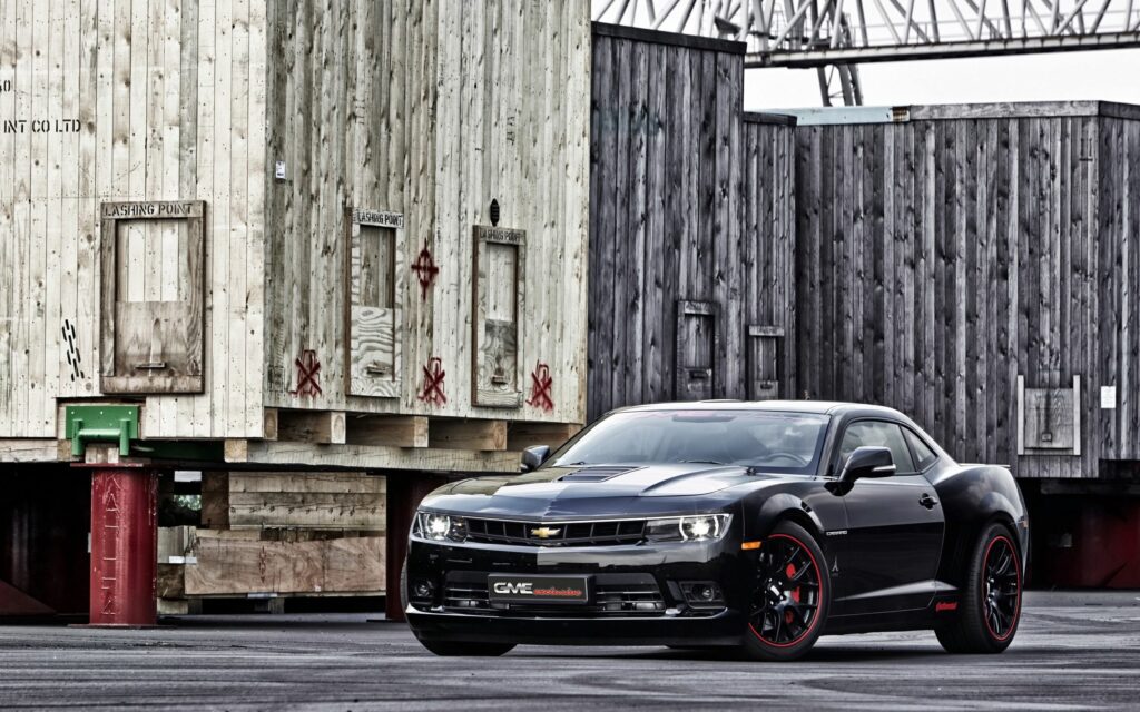 Stunning Black Chevrolet Camaro SS Wallpaper with Industrial Background