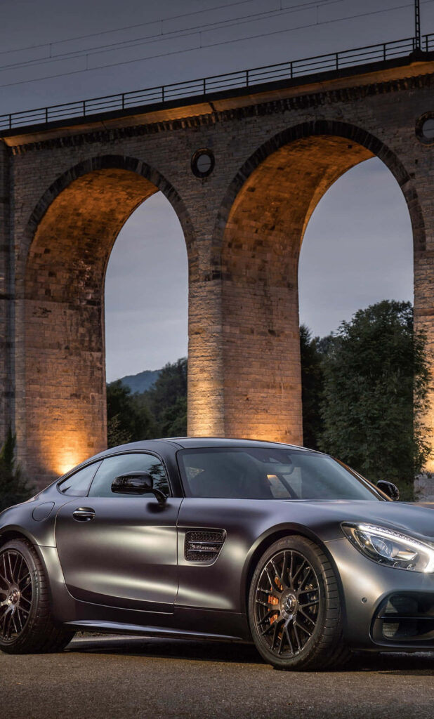 Luxurious Black Mercedes-AMG GT S Wallpaper Under Stone Bridge