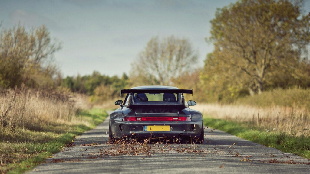 Stunning Black Porsche 911 RWB Custom Wallpaper on Scenic Road