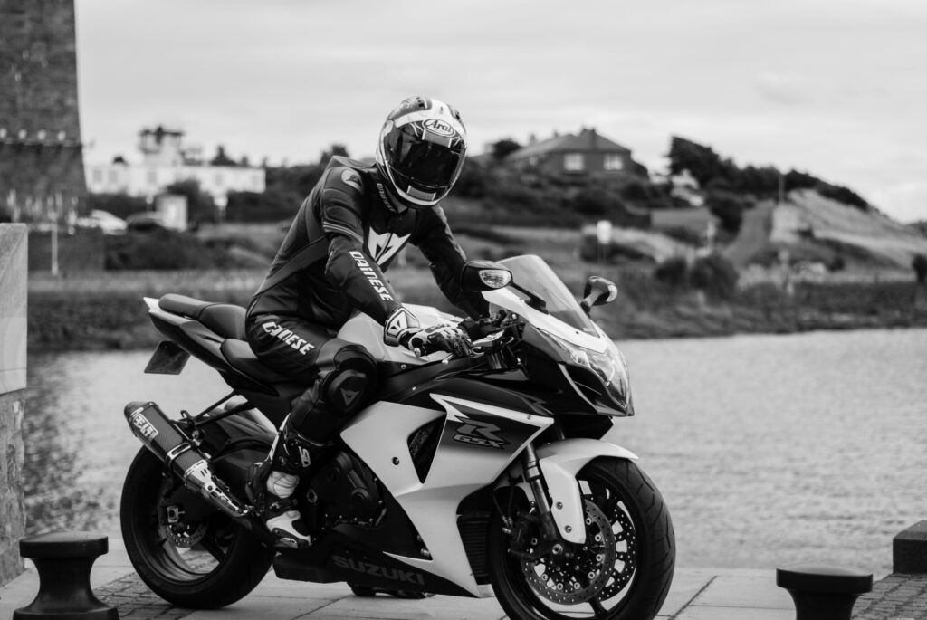 Black and White Motorcycle Wallpaper: Adventurous Biker by Waterfront
