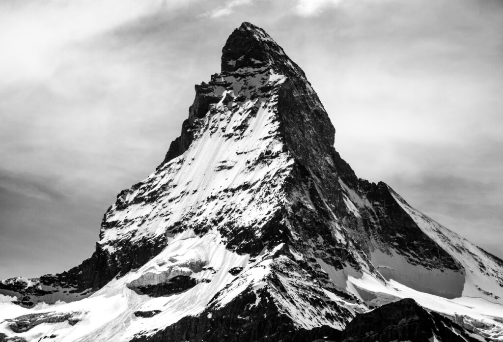 Majestic Mountain Black & White Wallpaper with Dramatic Sky