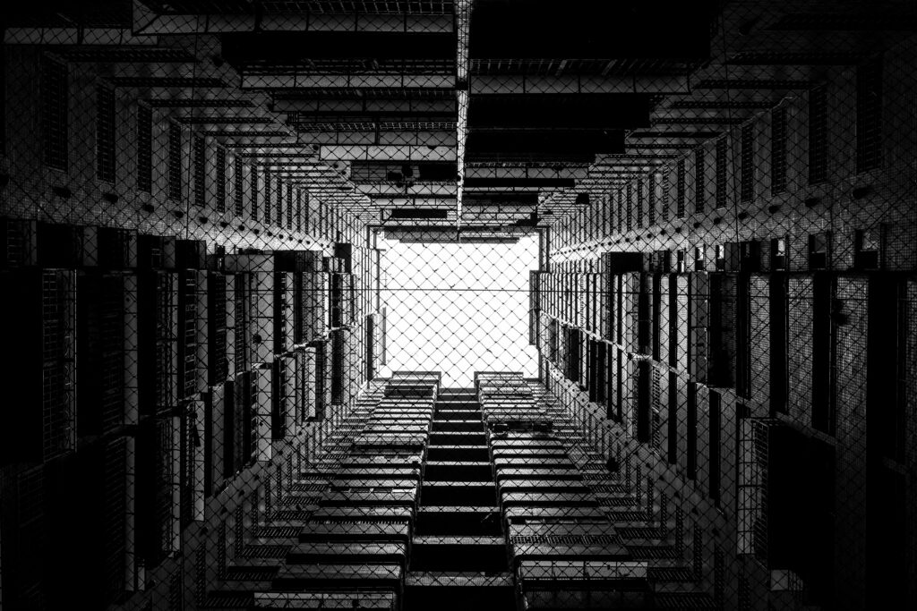 Stunning Black & White Wallpaper: Dramatic Building View with Mesh Framing