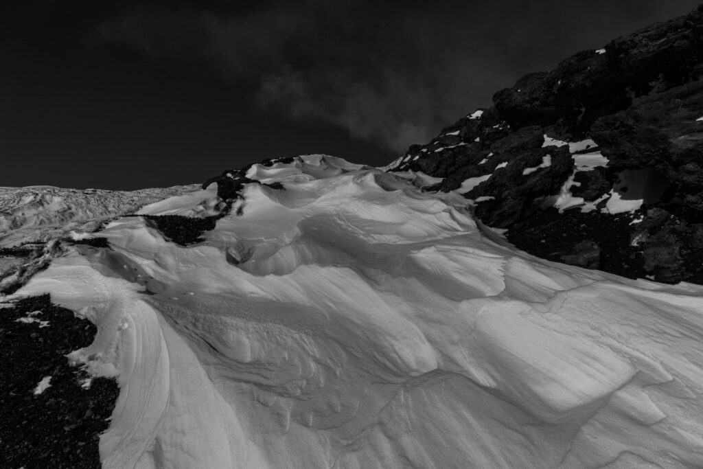 Stark Black and White Mountain Wallpaper with Snow Patterns