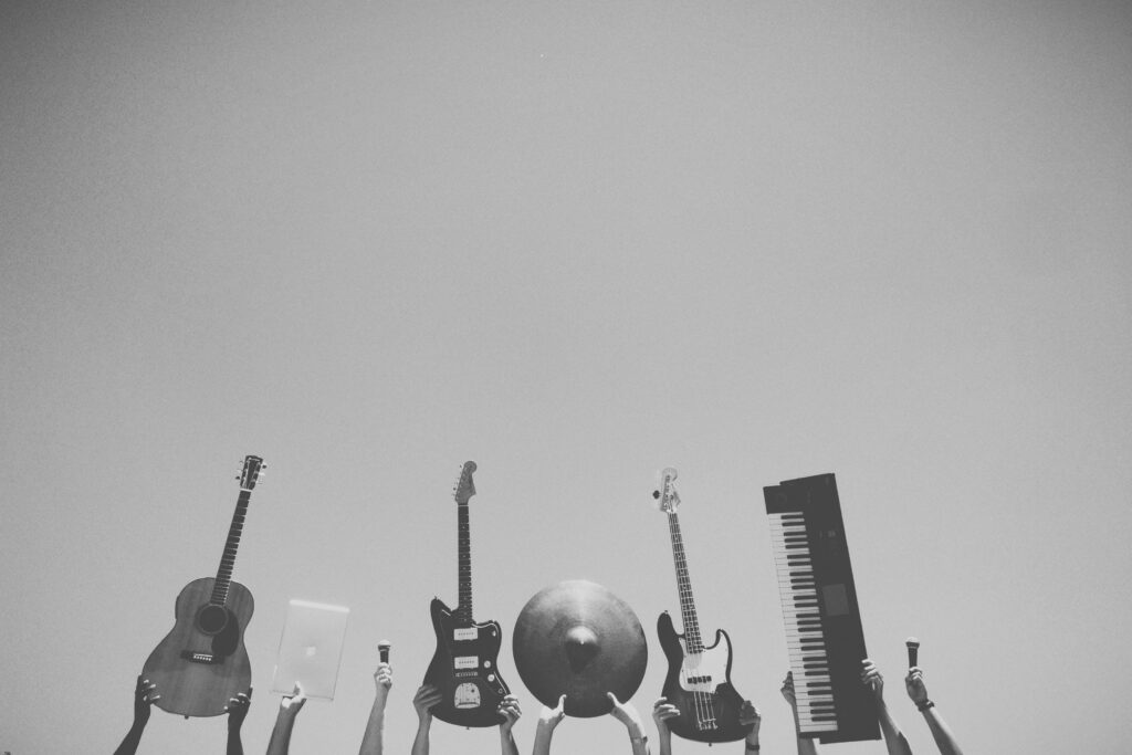 Elegant Black and White Wallpaper of Musical Instruments Against Sky