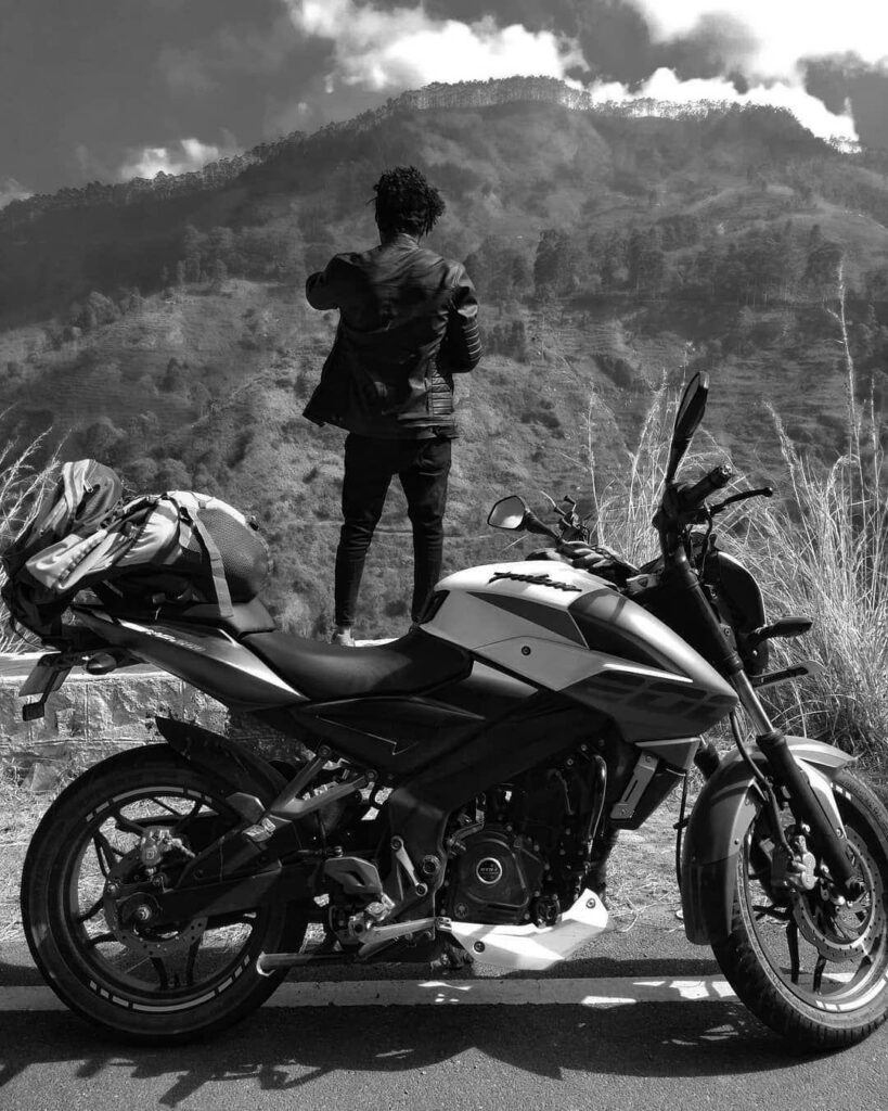 Bold Black & White Wallpaper: Rider with NS 200 in Mountain Adventure