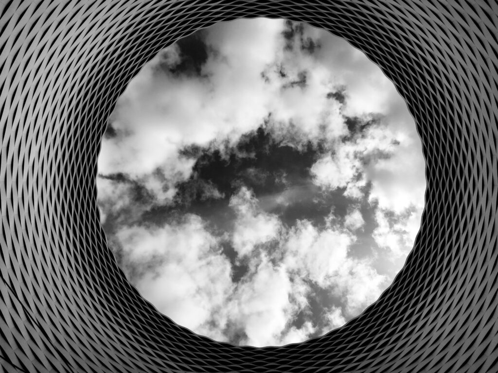 Captivating Black and White Sky Wallpaper with Unique Architectural Frame
